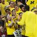 Michigan fans high five fifth-year senior Corey Person as he makes his way through the crowd before the start of the first half against Indiana at Crisler Center on Sunday, March 10, 2013. Melanie Maxwell I AnnArbor.com